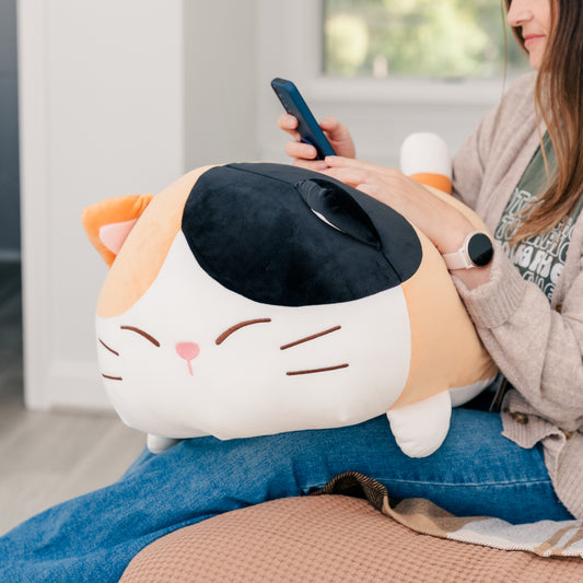 Plush Camang takes up the model's entire lap.