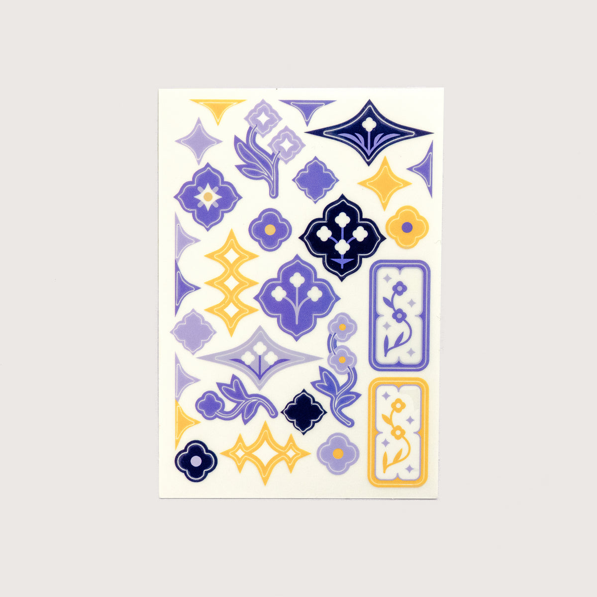 A single sheet of the Speedwell Art Stickers by Kevin Jay Stanton featuring twenty-eight miniature illustrations of Speedwell flowers in indigo, white, and yellow.