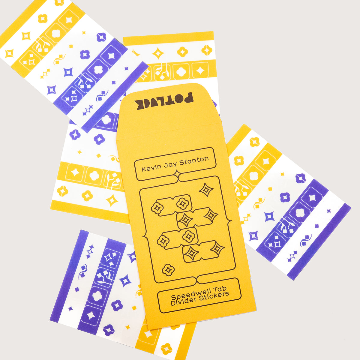 A set of Speedwell Tab Divider Stickers by Kevin Jay Stanton, featuring the yellow seed envelope packaging in the center surrounded by five sticker sheets of tab dividers in indigo, yellow, and white.