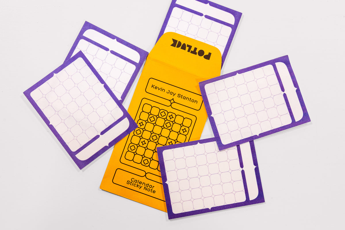 A arrangement of Calendar Sticky Note Sheets by Kevin Jay Stanton surrounding the yellow envelope packaging in the center.