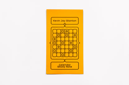 The yellow envelope packaging for the Calendar Sticky Note by Kevin Jay Stanton against a white background.