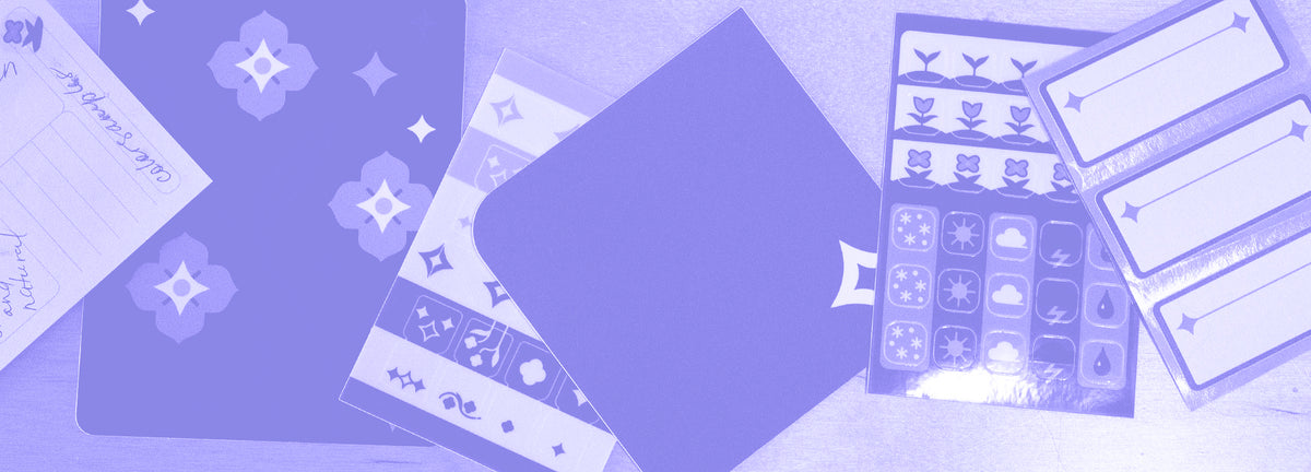 Flat lay view of the Speedwell Stationery items including Archivist Sticky Note, Cover Sticker, Tab Divider Stickers, Pocke Sticker, Icon Stickers, and Nameplate Stickers,with a lavender overlay upon the entire image.