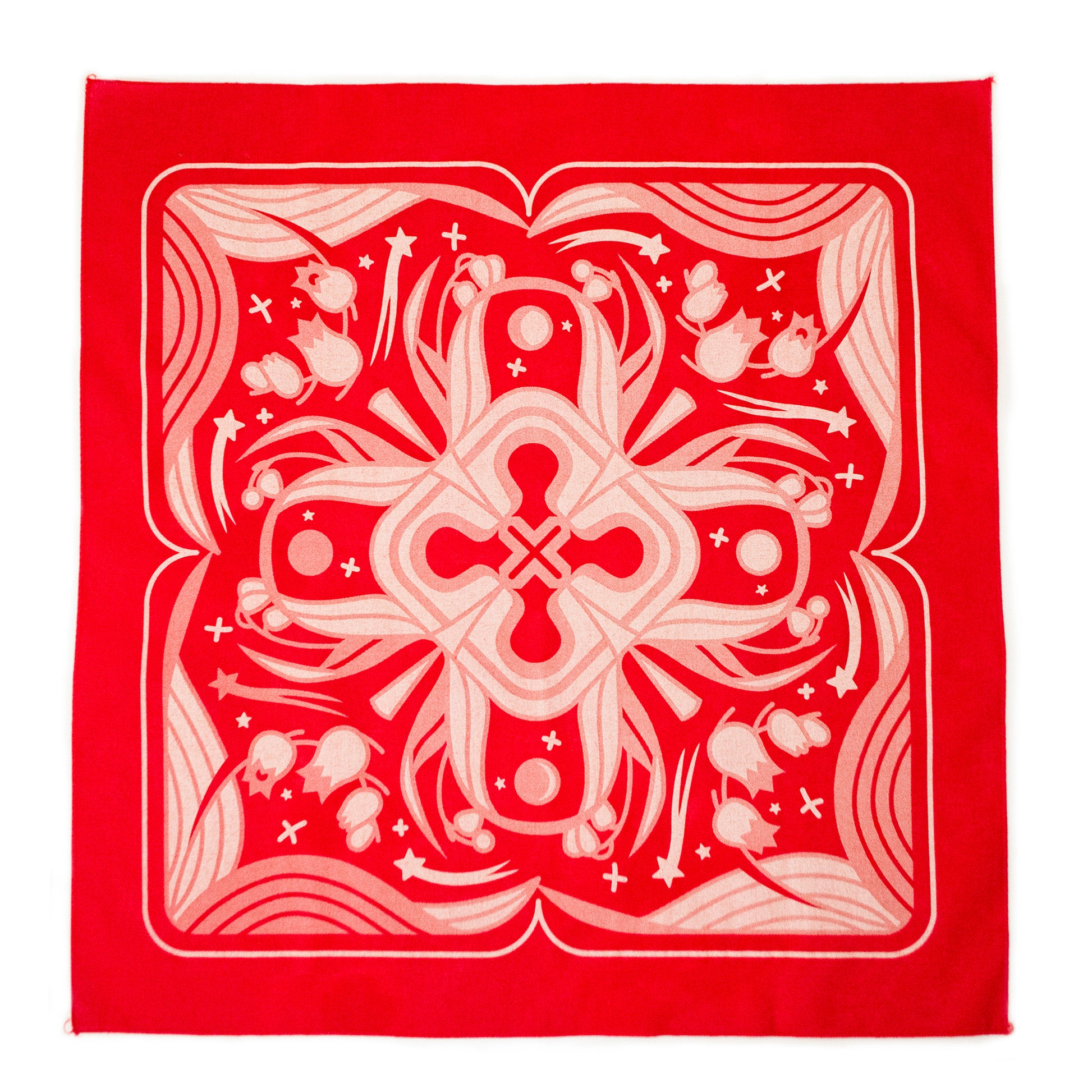 A flat lay photograph of the red Sacred Blood Bandana. The bandana is printed with faded pinks and creams, illustrating lily of the valley, sparkles and lilly of the valley leaves in the four mirrored quadrants.
