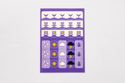 A single sheet of the Speedwell Icon Stickers by Kevin Jay Stanton featuring thirty individual stickers in indigo, white, and yellow.
