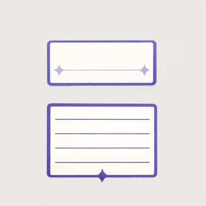 Two white and indigo label stickers. The first features a single line for written text. The second has four lines for written text.