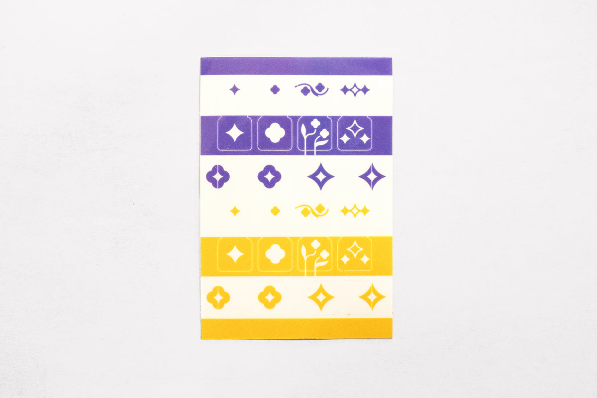 A single sheet of the Speedwell Tab Divider Stickers by Kevin Jay Stanton featuring twelve individual tab divider stickers in indigo, white, and yellow.