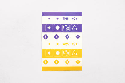 A single sheet of the Speedwell Tab Divider Stickers by Kevin Jay Stanton featuring twelve individual tab divider stickers in indigo, white, and yellow.