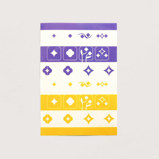A single sheet of the Speedwell Tab Divider Stickers by Kevin Jay Stanton featuring twelve individual tab divider stickers in indigo, white, and yellow.