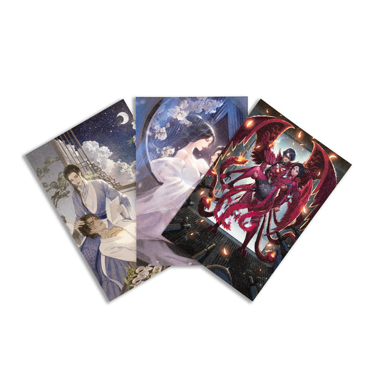 The three illustrated prints comprising the Iron Trio Postcard Set  are fanned out. From left to right: Shimin lounges on Yizhi's lap while they enjoy tea in the moonlight; Zetian romantically straddles Yizhi, dressed in a gossamer moonlit dress; and winged Shimin holding winged Zetian in a bay doorway surrounded by glowing feathers.