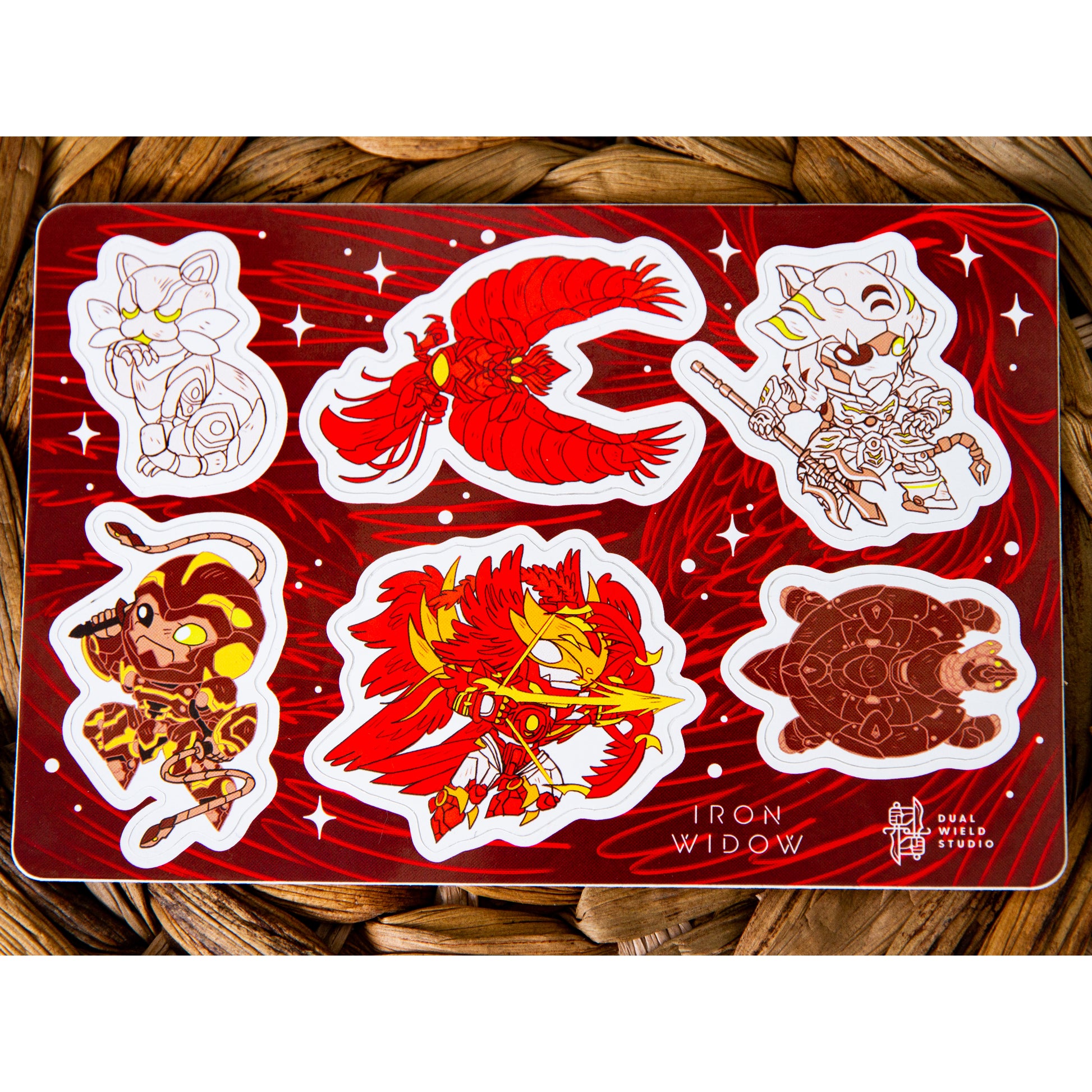 Iron Widow: Mecha Sticker sheet resting on a warm brown wicker background.